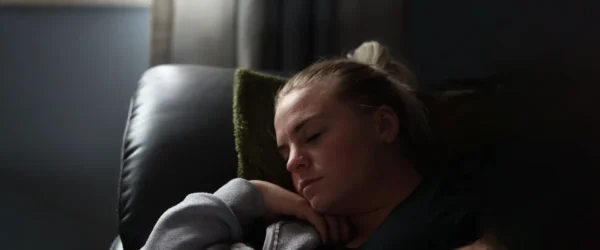 person sleeping on chair